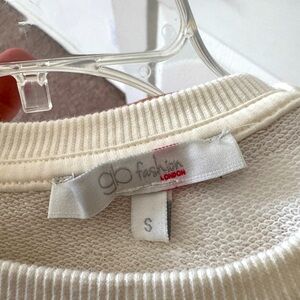 Worn a couple of times. Beautiful cream color sweater.